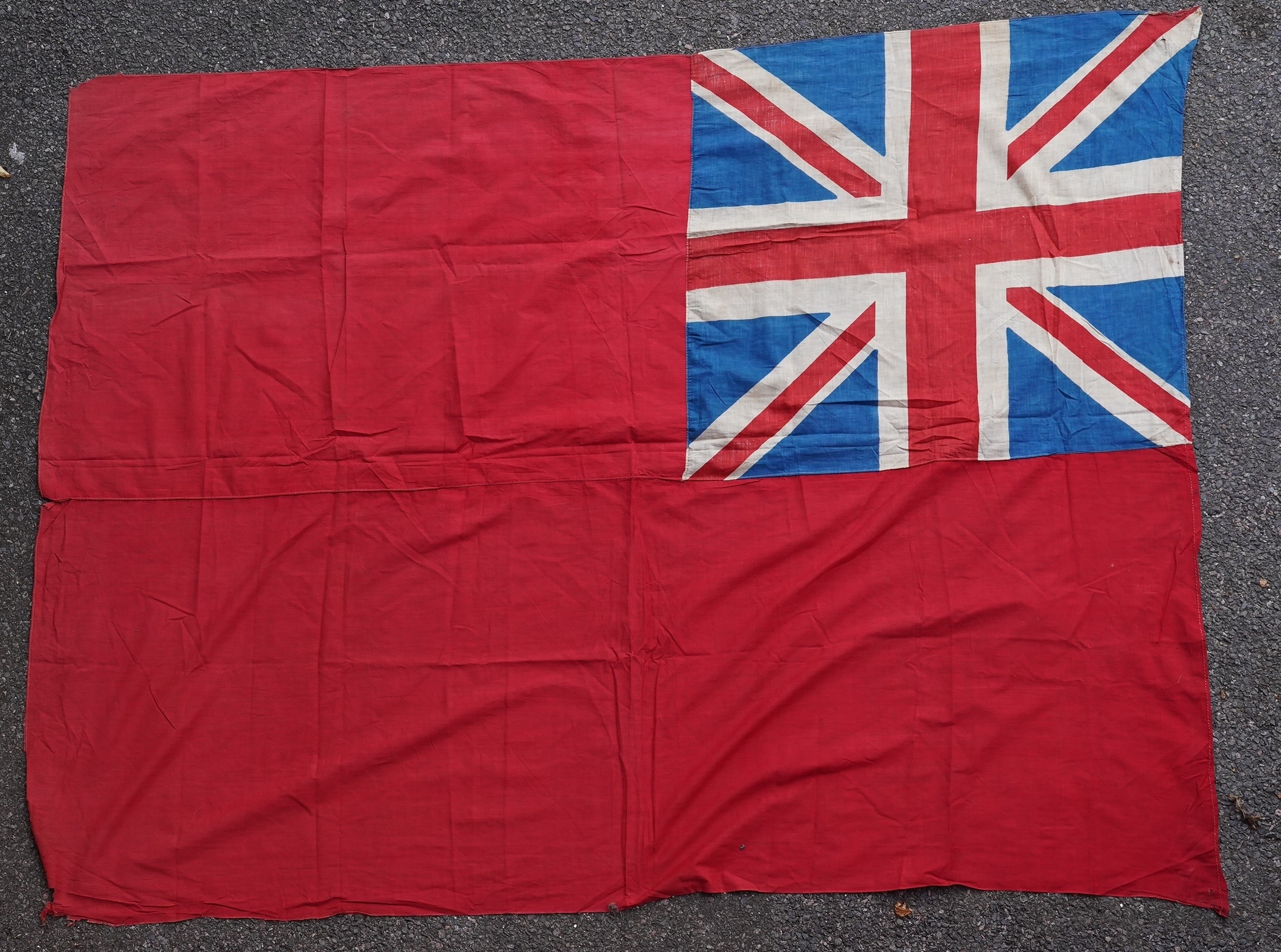 Four flags; two professionally made US Stars and Stripes, both on thick canvas with applied stars and joined stripes, one by the Valley Forge Flag Co., Pennsylvania, stamped “5 x 9.5 ft”, 146 x 288cm and 176 x 300cm, tog